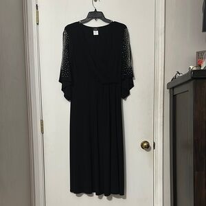 Elegant Black Dress with Embellished Sleeves
